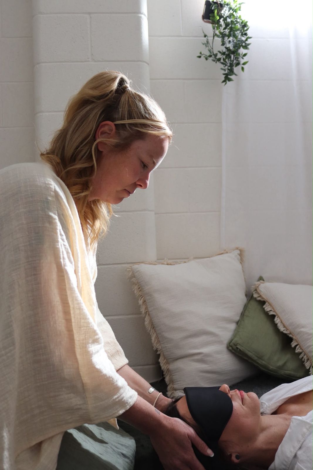 Tessa guiding a client through breathwork
